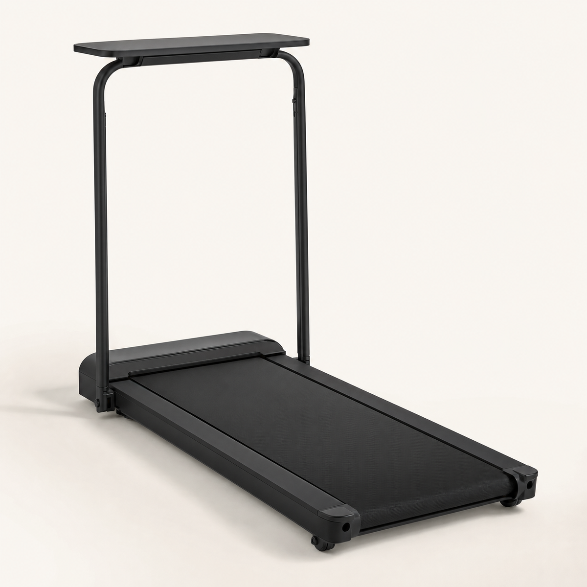 Walking pad with handrail up and desk tray on top, studio view